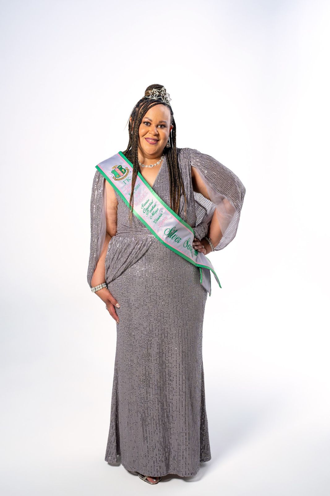 Portrait in silver gown with sash and star tiara