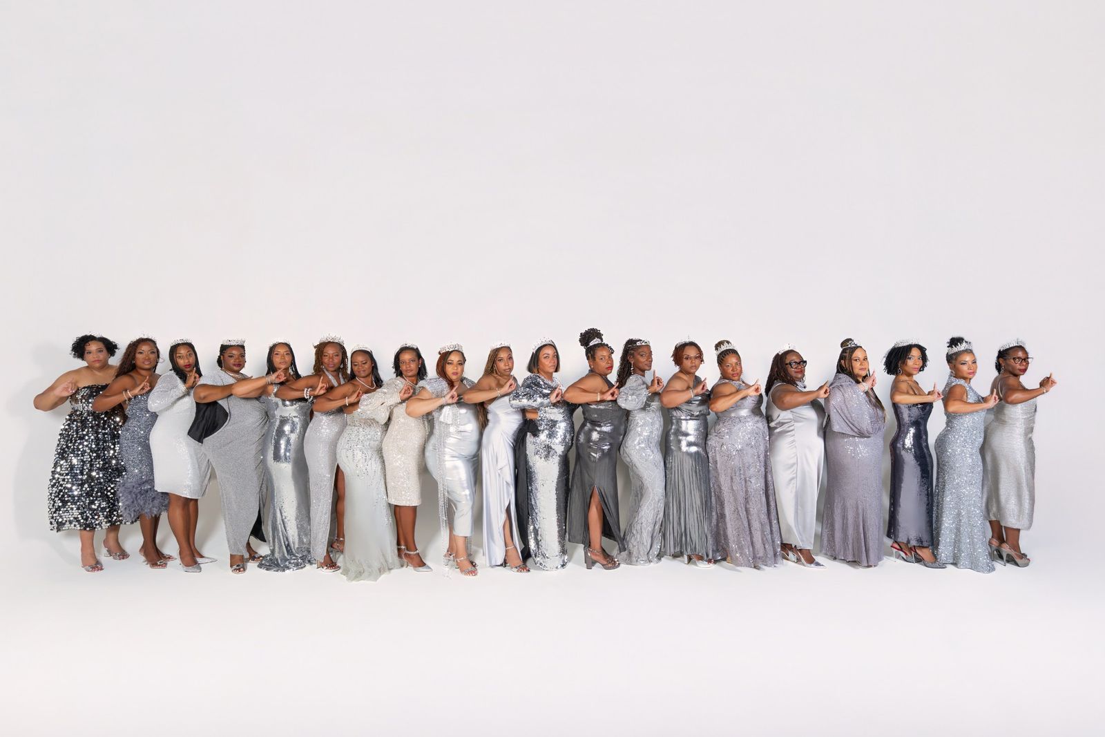 Chapter line smiling in silver gowns