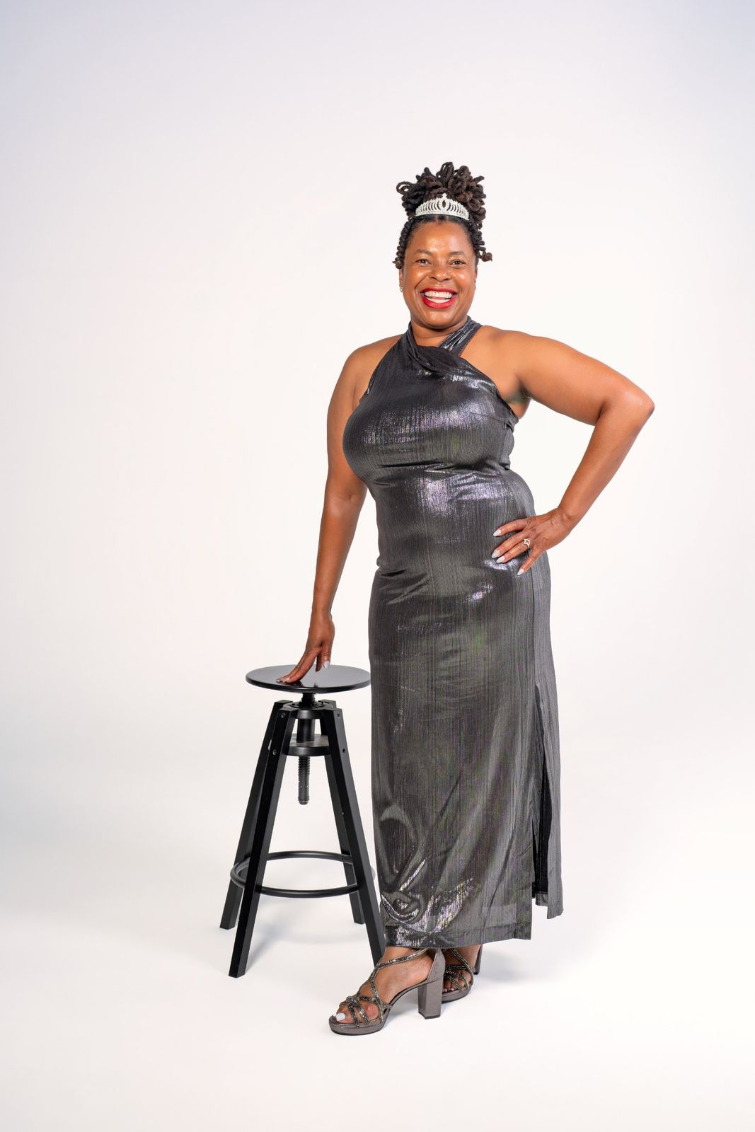 Standing portrait with stool, tiara and gown